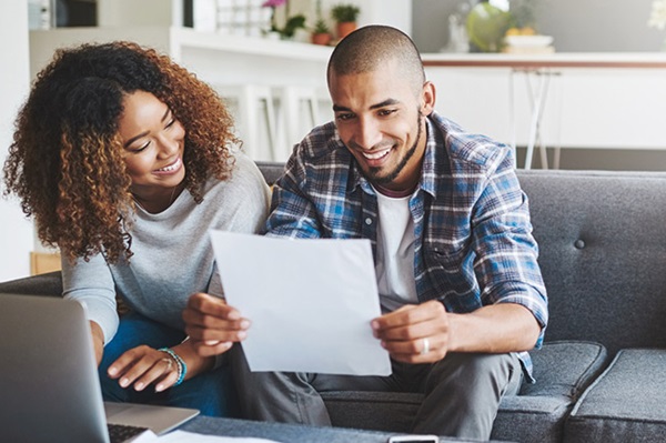 Happy couple looking at their Lifetime ISAs