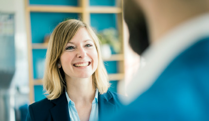 women smiling at a man