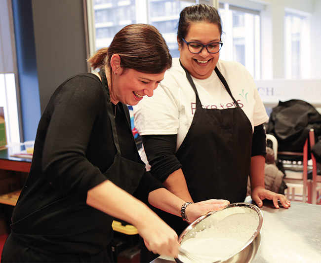 Happy Foresters members at an event making meals for the homeless