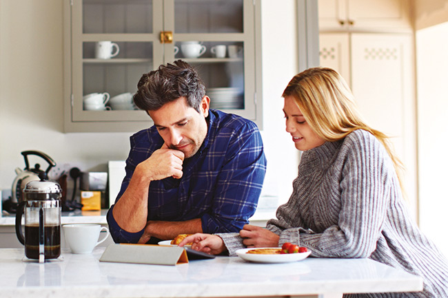 Lifetime ISA customers sitting in the kitchen looking for first home