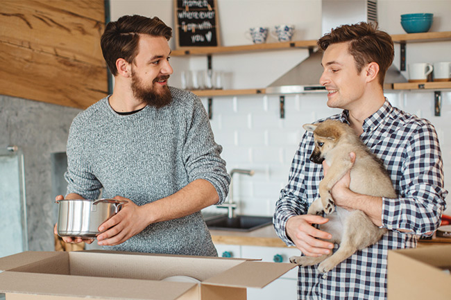 Lifetime ISA customers in the kitchen unpacking after buying their first home 