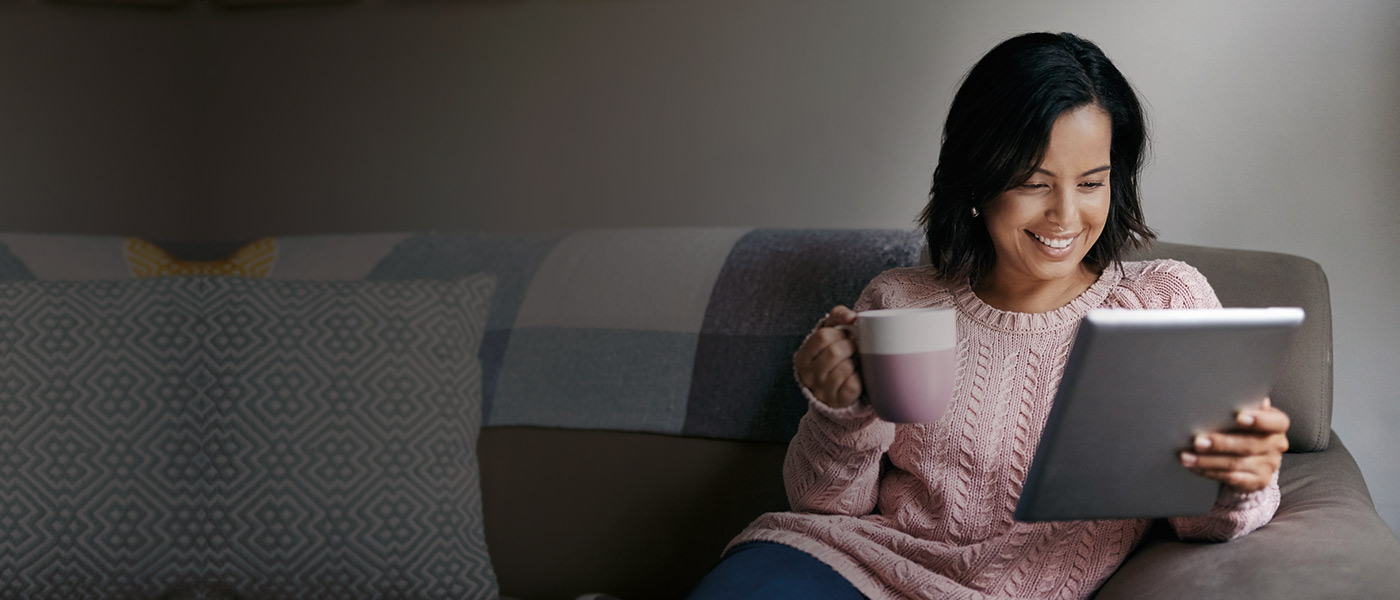 Woman using her tablet to request an Adviser to discuss a Personal Pension Plan