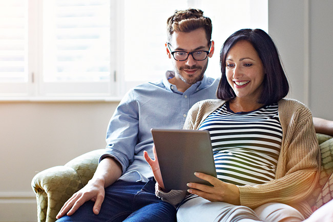 Savings & Investment Plan customers on their tablet checking their MyPlans account