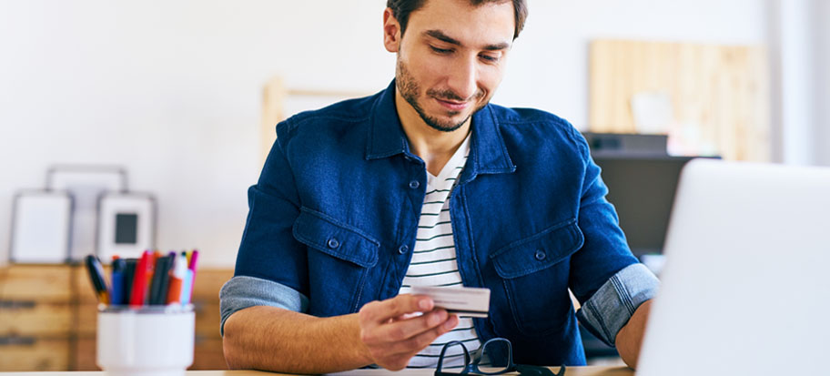 Man making card payment through internet