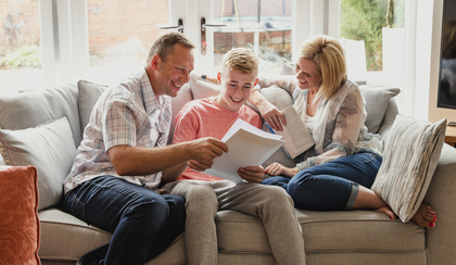 Parents with son on the sofa who has a CTF with Foresters