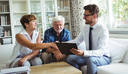 Couple shaking hands with a Forester Life Financial Adviser 