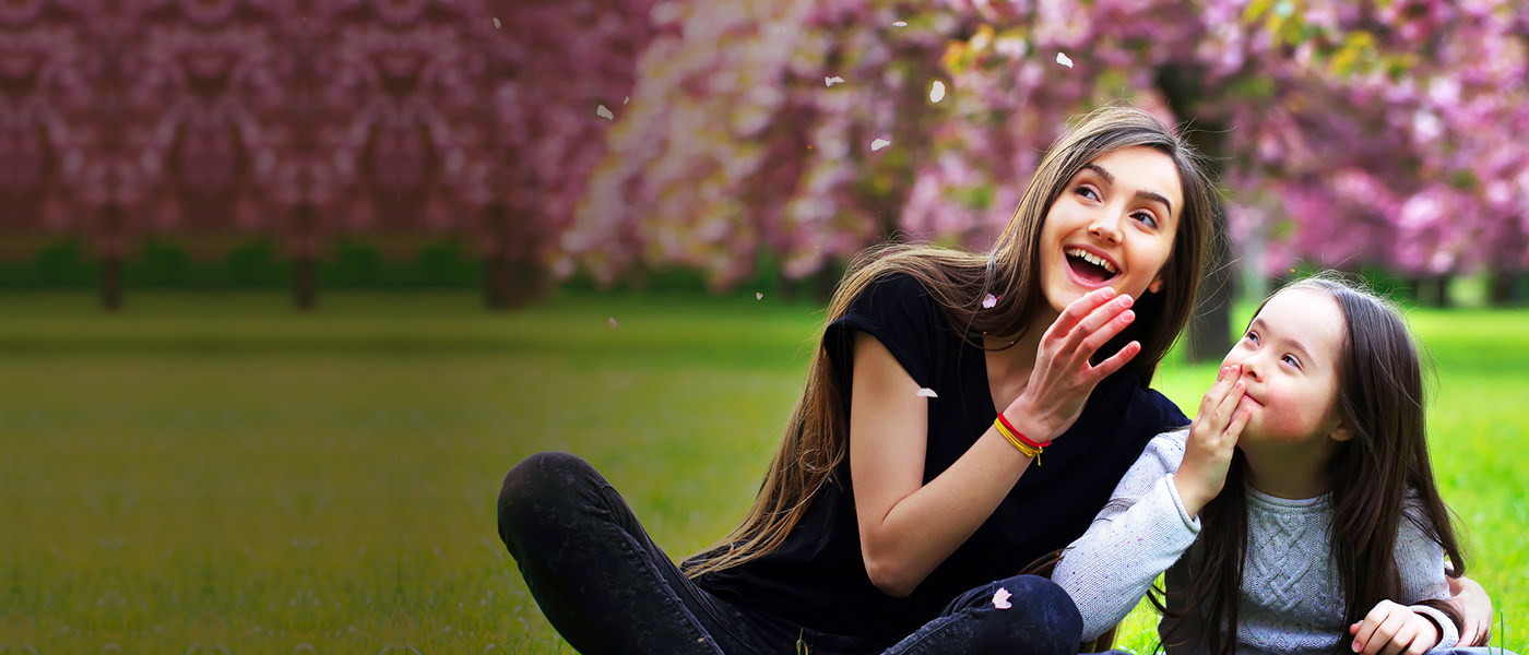 Happy teenager with a Child Trust Fund talking to younger sister