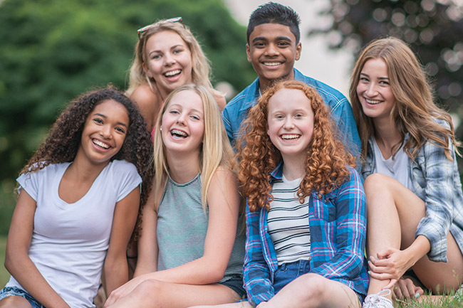 Group of teenagers in the park with Foresters Child Trust Funds