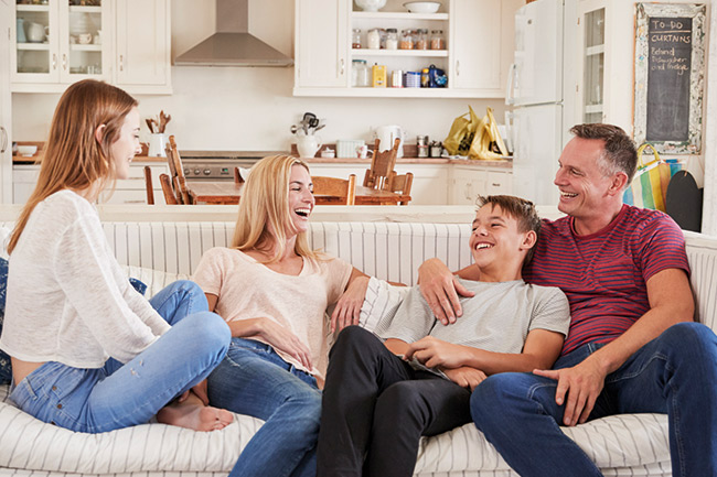 Parents discussing CTFs with their children on the sofa