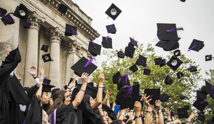 Students graduating throwing mortar boards