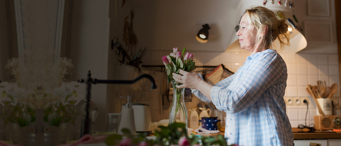 woman sorting a bunch of flowers after making a Foresters protection claim