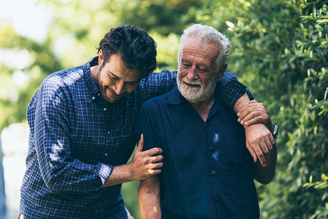father caring for son in the park