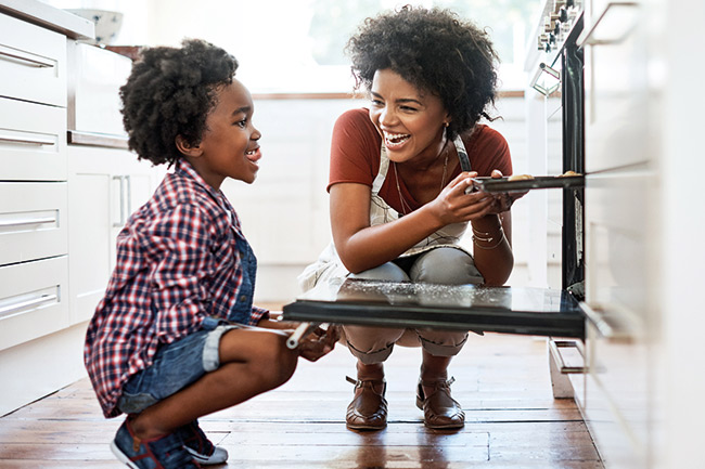 Mother and son baking who have mortgage protection for the home