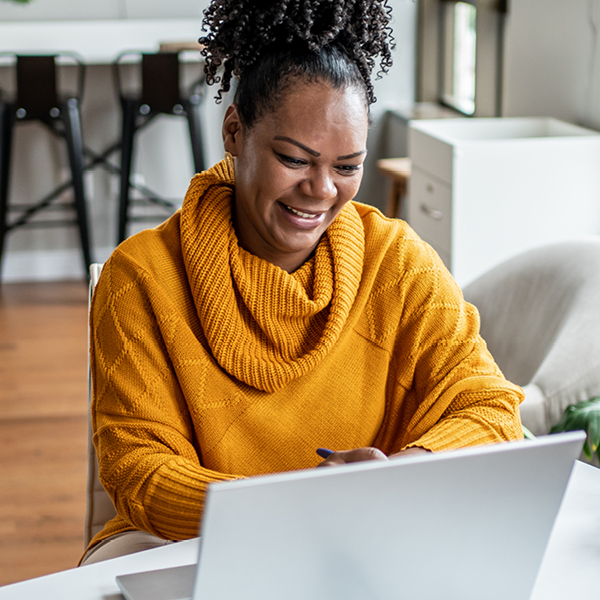 Woman looking at laptop