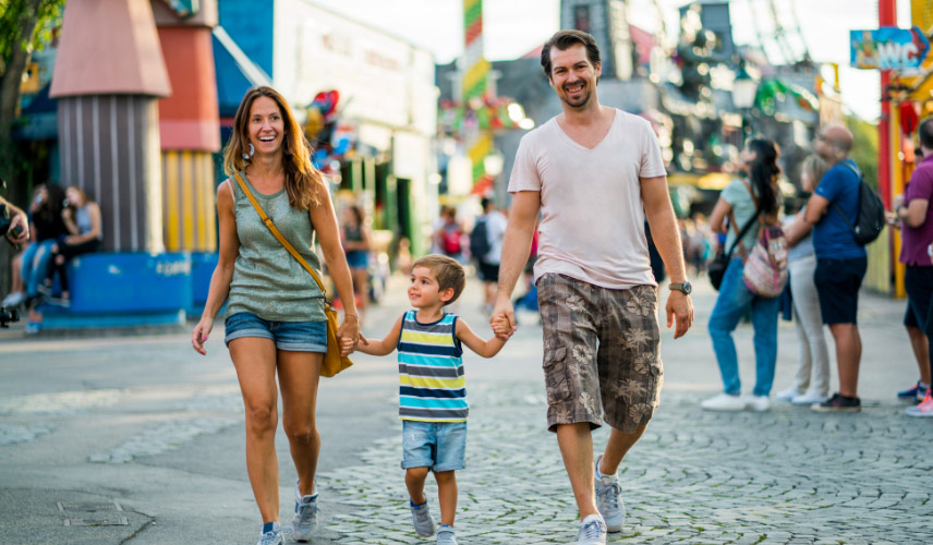 Family walking in amusement park