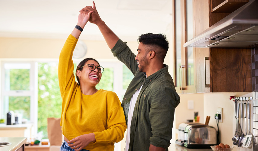 two people dancing and smiling